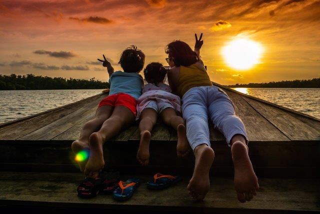 Mother with children at sunset in Cambodia