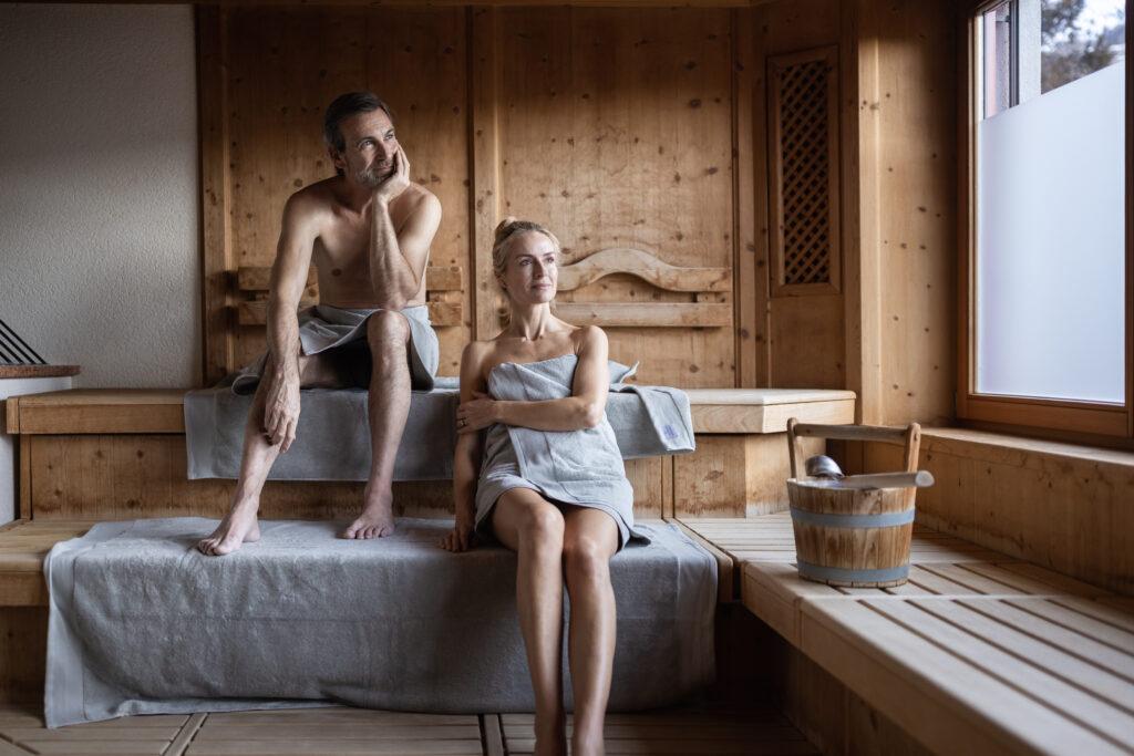 A couple in the sauna at the sustainable Hotel Outside