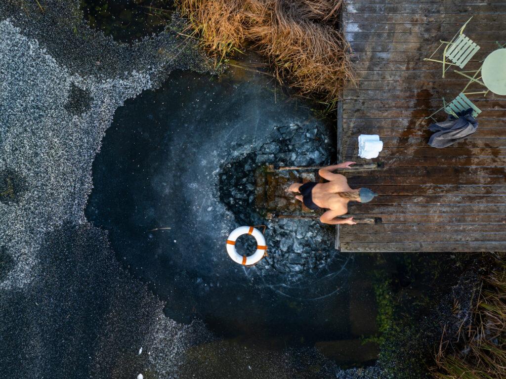 Aerial view of ice swimming in the natural swimming pond at Hotel STURM in the Rhön, Germany