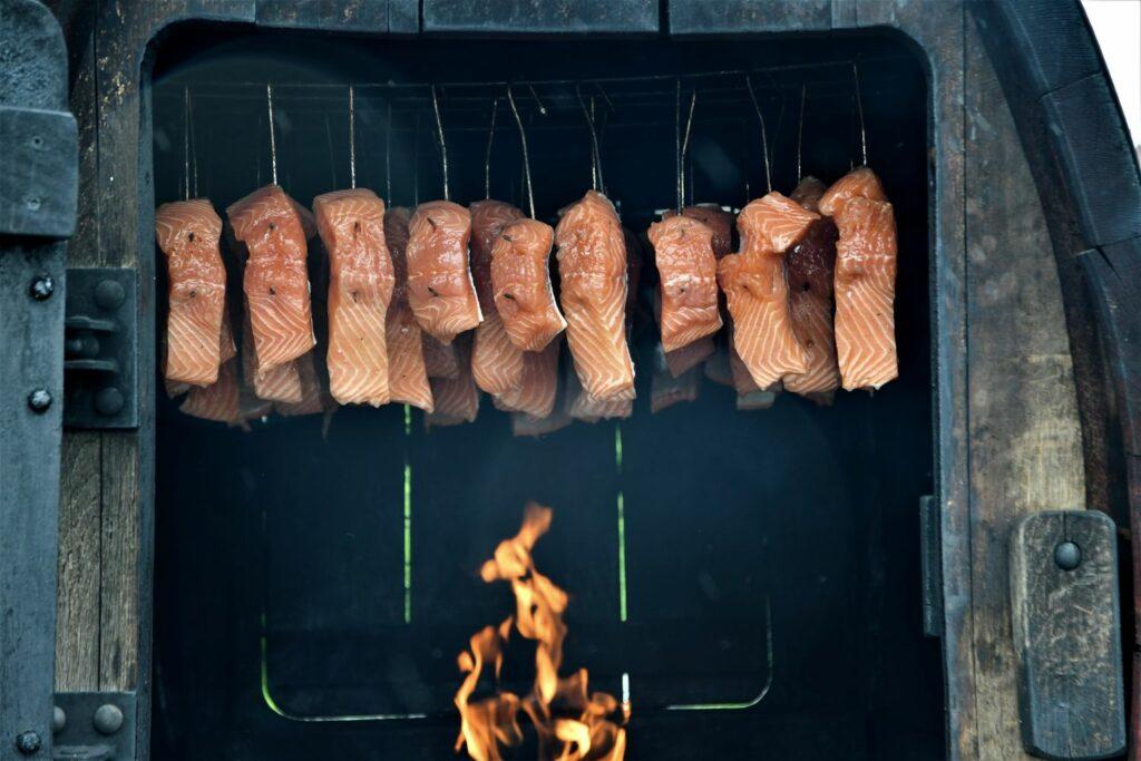 Smoked salmon over the fire. Baltic sea cuisine 