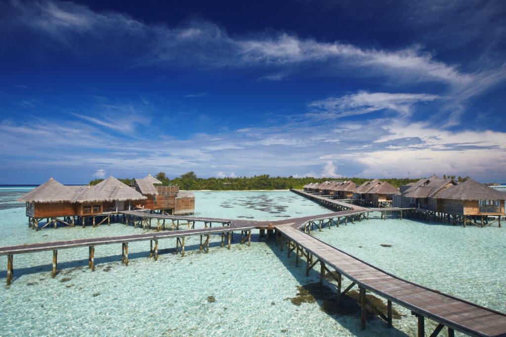 The Gili Lankanfushi Resort is located in the Maldives. View of jetties and the sky. A holiday atmosphere.