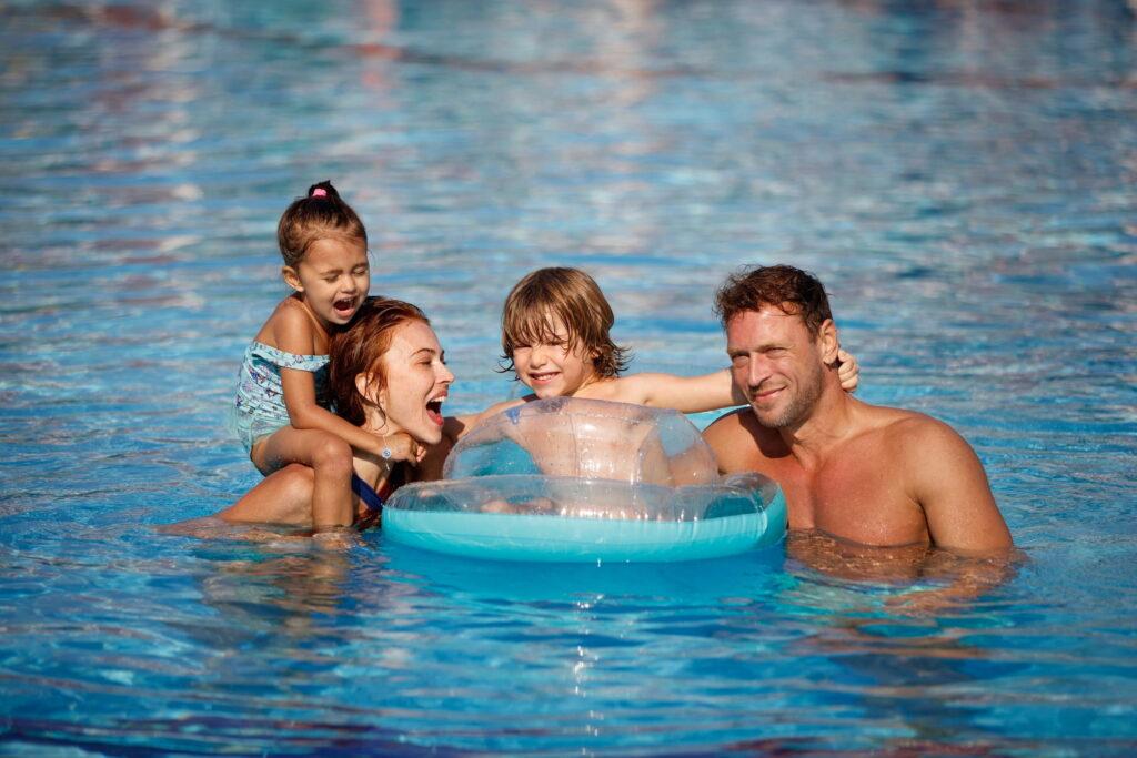Beach vacation in Turkey - Family with a swim ring in the sea