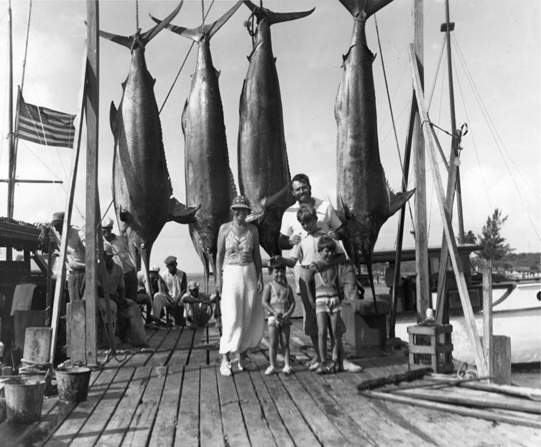 Pauline, Patrick, Ernest, John, and Gregory Hemingway with four marlins on the dock in Bimini, 20 July 1935. 