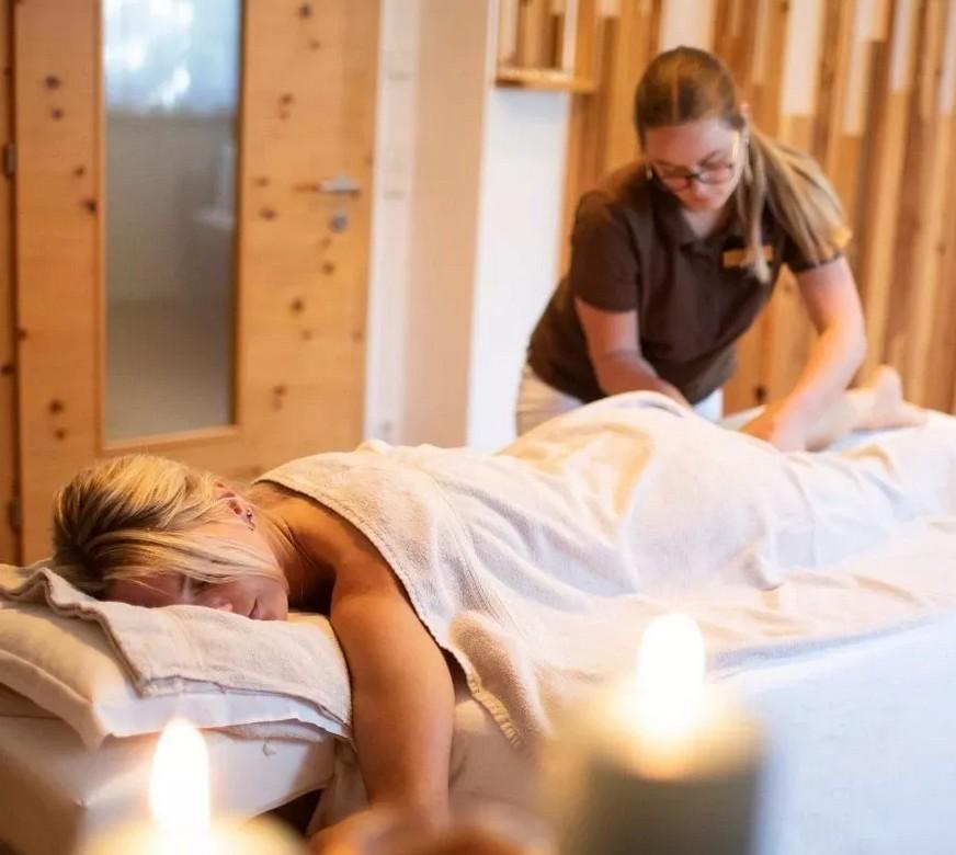Woman enjoying a massage at the sustainable Hotel Weihrerhof in South Tyrol