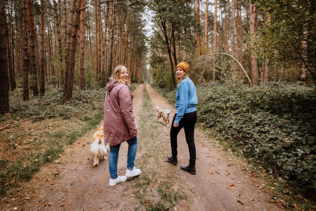 The Okelmann sisters in the forest with their dogs