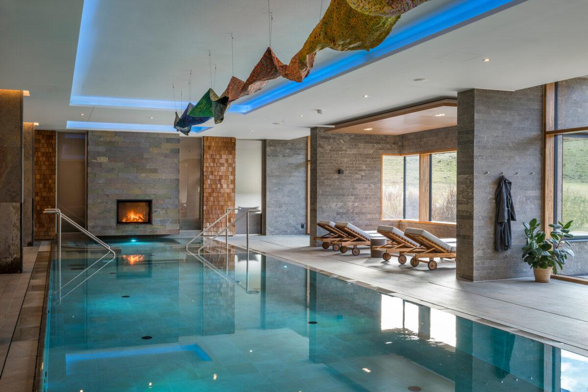 Swimming pool at the Hotel Klosterhof Alpine Hideaway & Spa following its “Glow Up” with Art - Rainbow Path