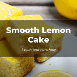 Close-up of yellow lemon cake squares, specialty from lifestylehotel SAND nature at the Baltic Sea, on a plate, with a whole lemon nearby. Overlay text says "Smooth Lemon Cake: Vegan and refreshing."