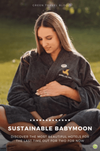 Sustainable Babymoon: The pin shows a pregnant woman wrapped in a bathrobe of the Klosterhof-Alpine Hideaway & Spa. She has her baby bump