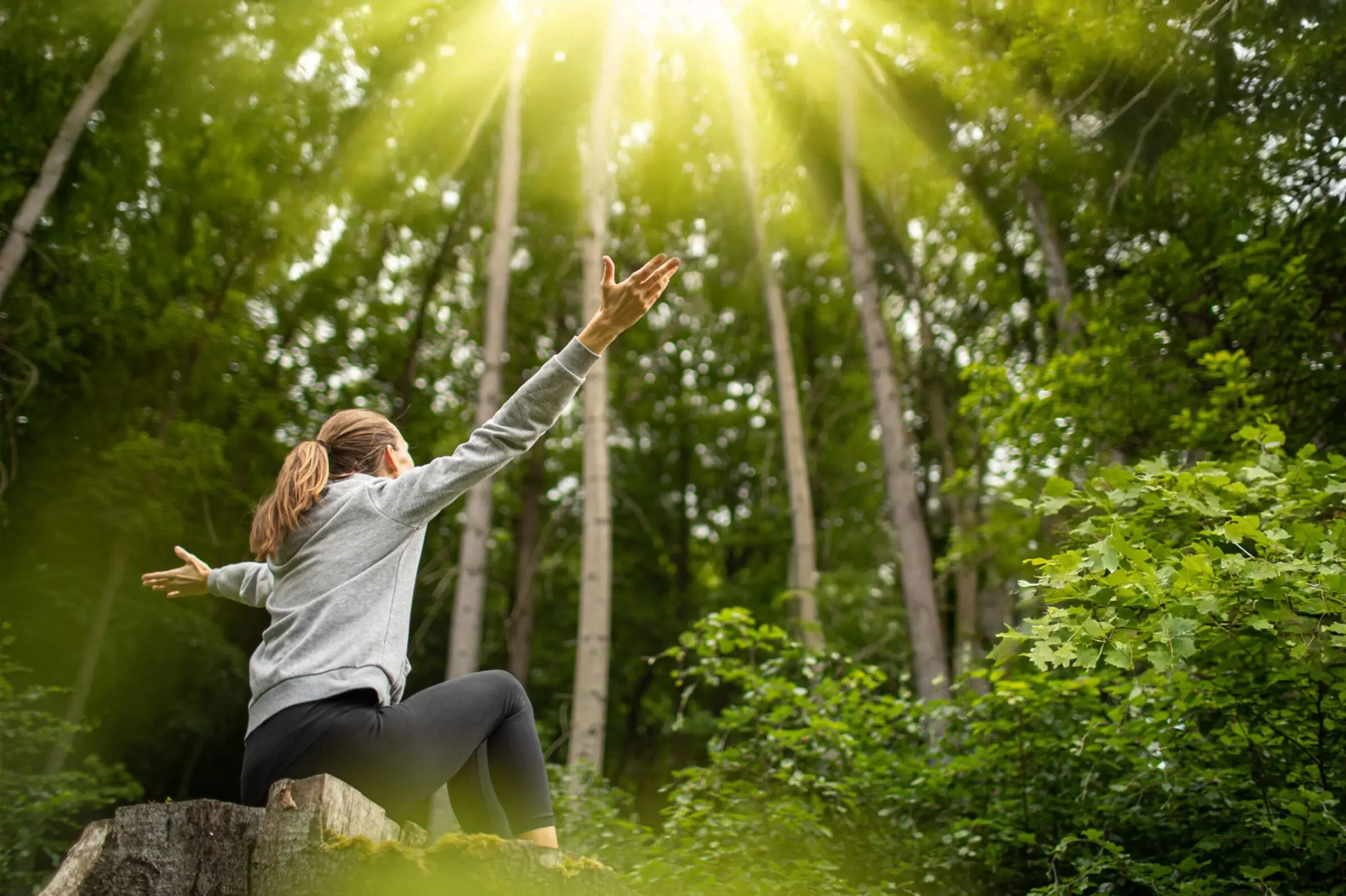 Woman enjoying forest bathing in the Black Forest
